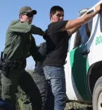 Border patrol police making an arrest