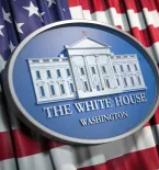 White House emblem American flag in the backgroiund