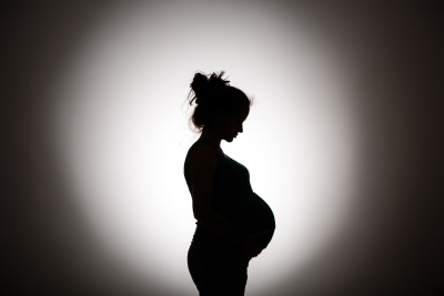 Silhouette of woman with child