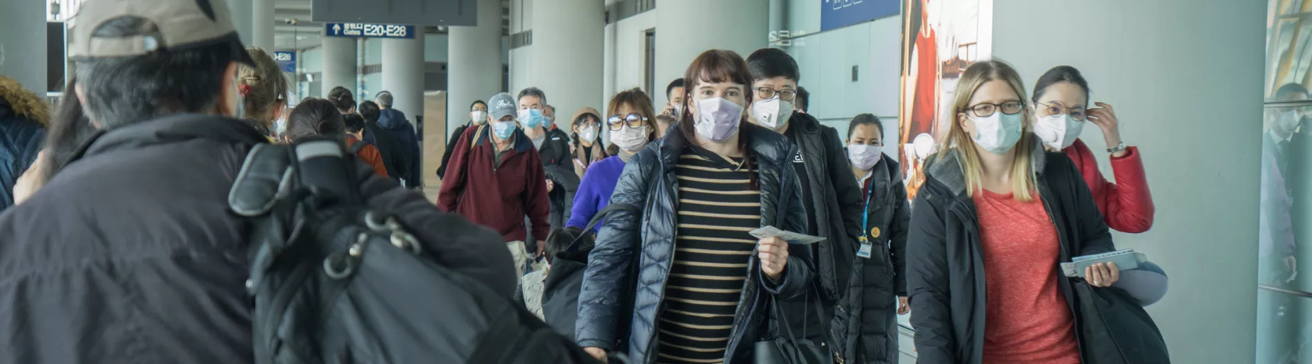People traveling wearing masks