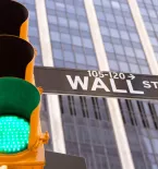 Green traffic light on Wall Street in New York City