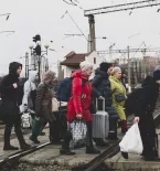 Ukraine people luggage train
