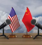 United States and China flag with two microphones