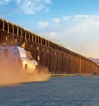 border patrol truck near border fence