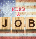 Sign "Need a Job" with American flag in the background