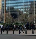 group of migrants lined up in NYC