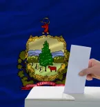 Ballot box with Vermont state flag in background