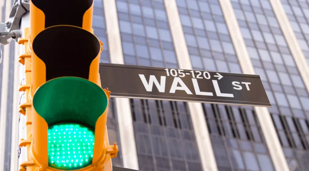 Green traffic light on Wall Street in New York City