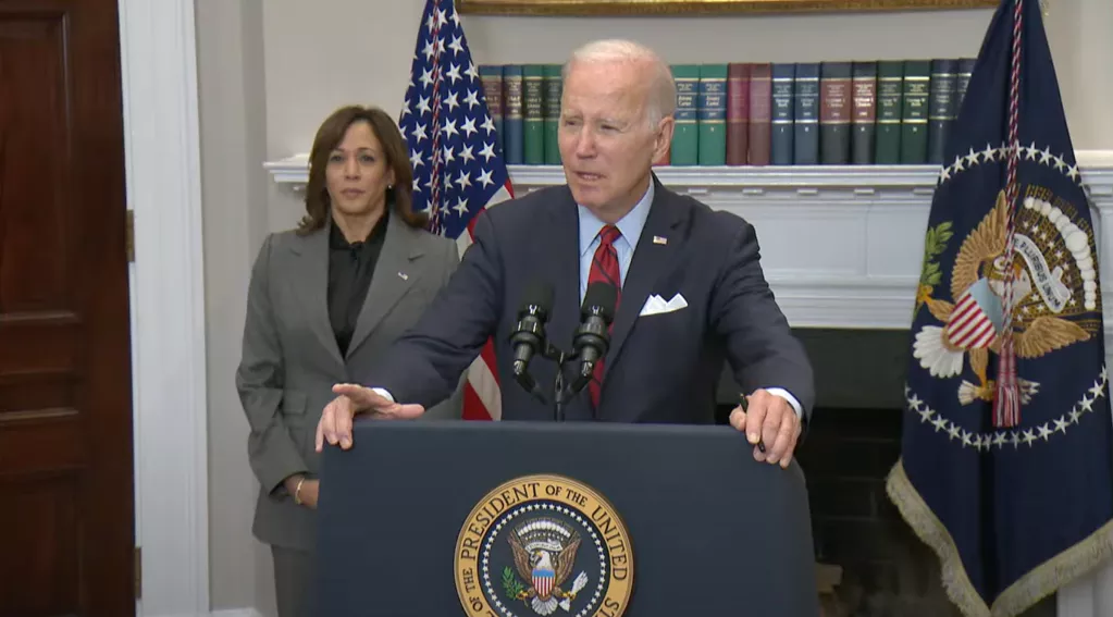 Biden speaking, Kamala in background