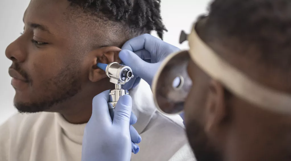 doctor checking ear