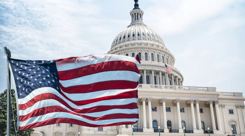 American flag waving on capital hill