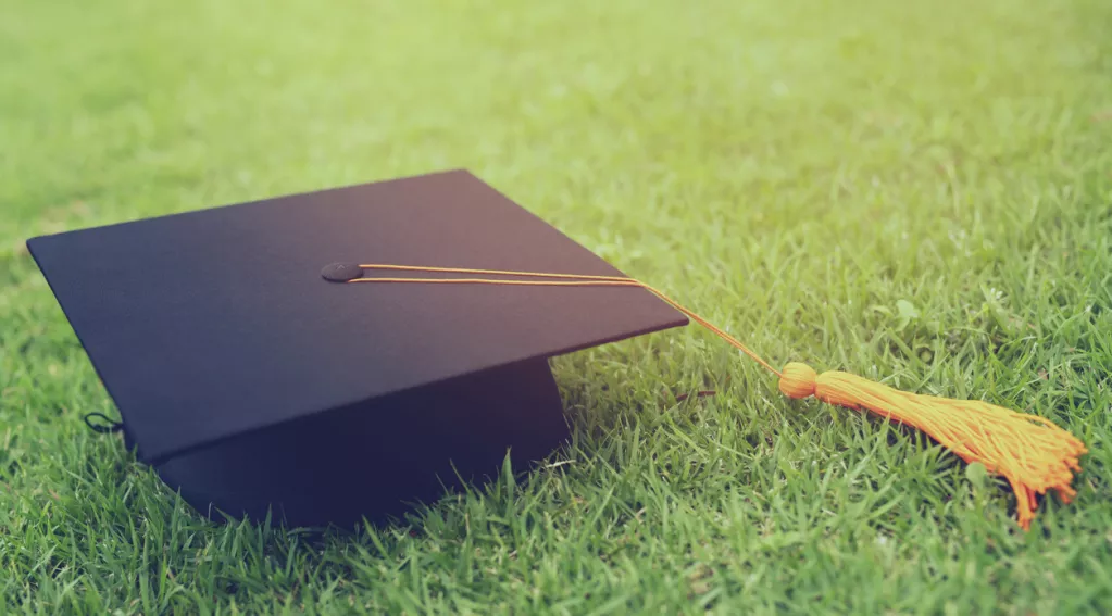 Graduation cap in the grass