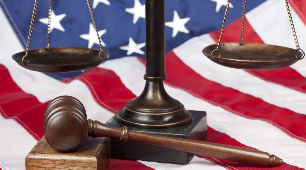 American flag, gavel and scale of justice