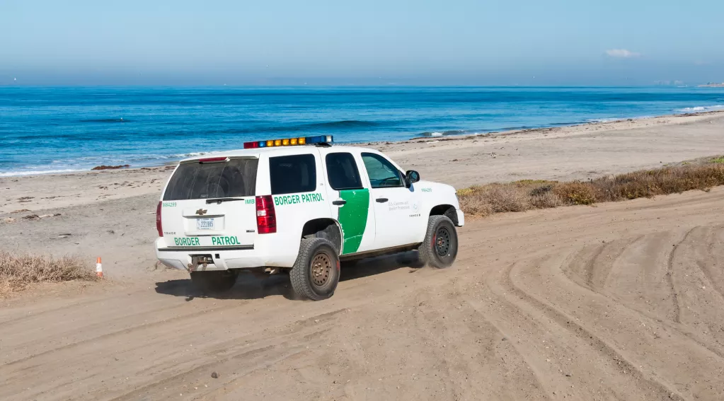 Ice patrol vehicle on beach border