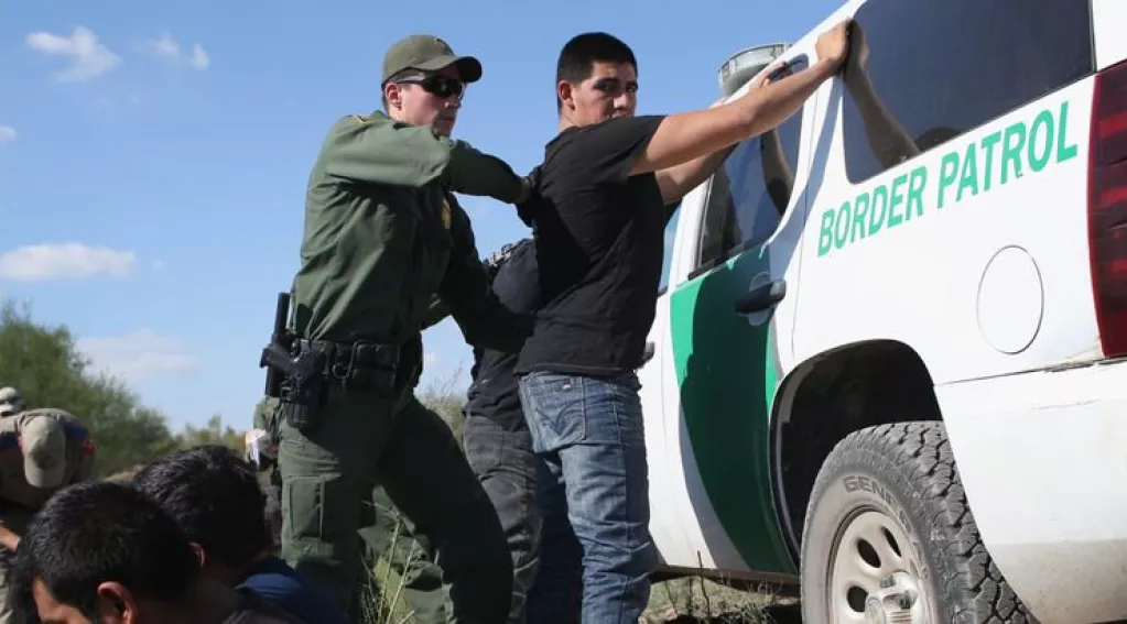 Border patrol police making an arrest
