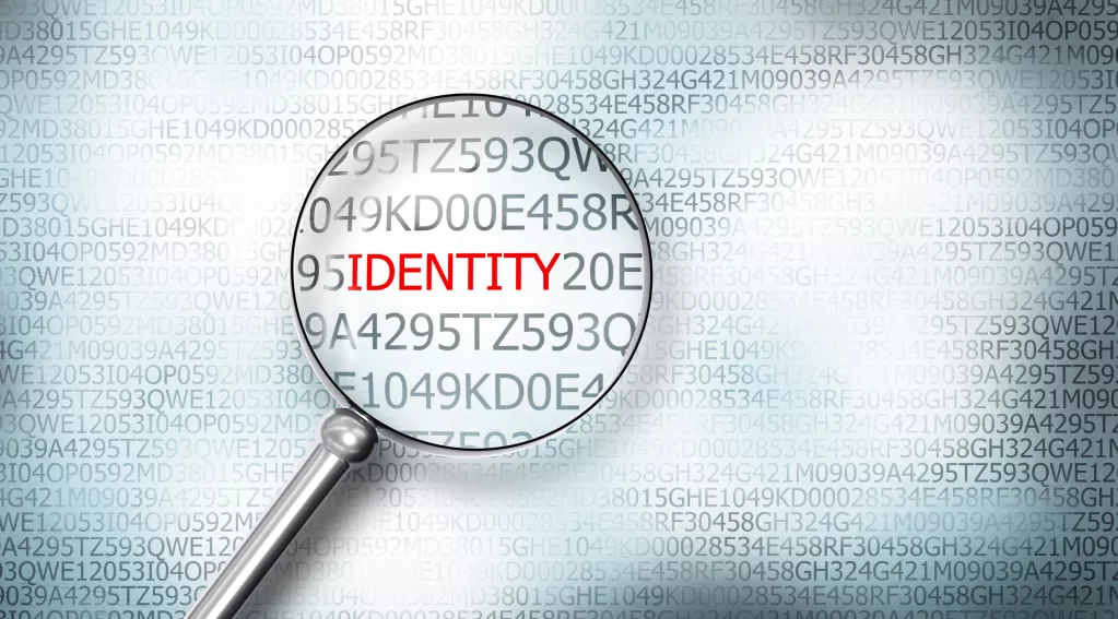 magnifying glass hovering over the word 'identity'