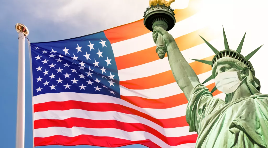 Statue of Liberty with COVID mask and United States flag