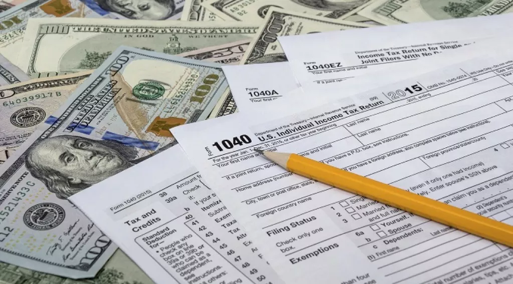 Taxes With Hundreds in the Background