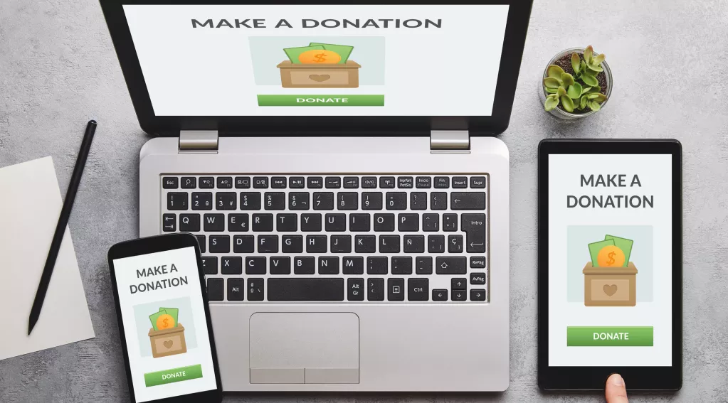 Different devices with the words Make a Donation